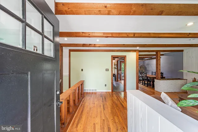 a view of a living room and front door