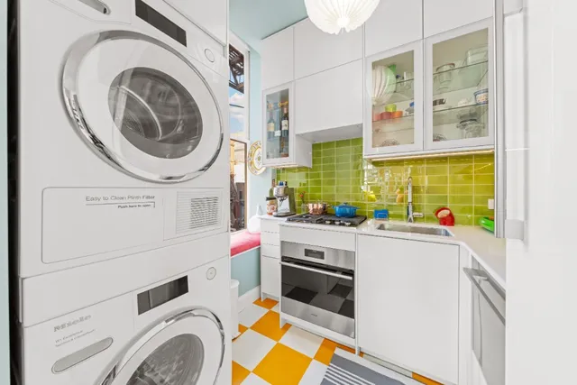 a kitchen with a stove and a white refrigerator