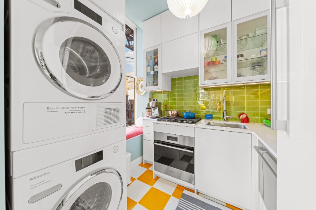 191 Clinton Street, Unit 2D Brooklyn, NY 11201 - Photo 6 of 30 a kitchen with a stove and a white refrigerator