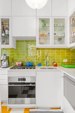a kitchen with stainless steel appliances a sink and a window