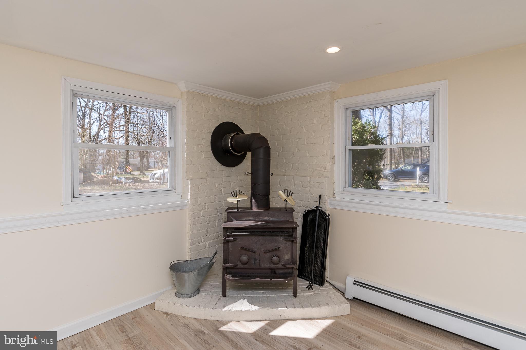 1516 Friendly Road Pasadena, MD 21122 - Photo 22 of 34 Wood stove in lower family room