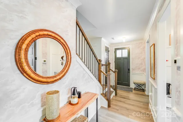 a view of a livingroom with furniture and wooden floor