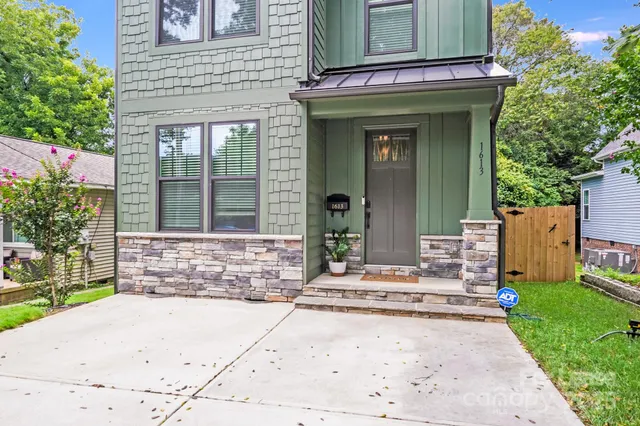a view of entrance of the house with a yard