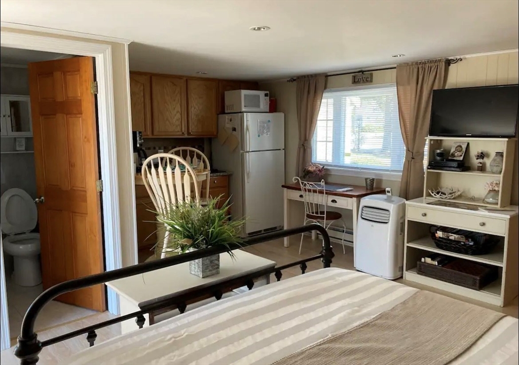 75 Beaten Road, Unit 12 Dennis, MA 02639 - Photo 6 of 26 a kitchen with sink refrigerator and stove