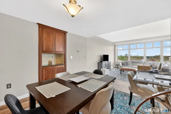 a view of a dining room with furniture window and outside view
