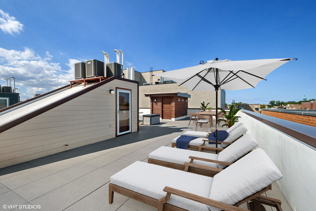 1424 West Fillmore Street, Unit 3E Chicago, IL 60607 - Photo 17 of 21 a view of a terrace with couches chairs and a table