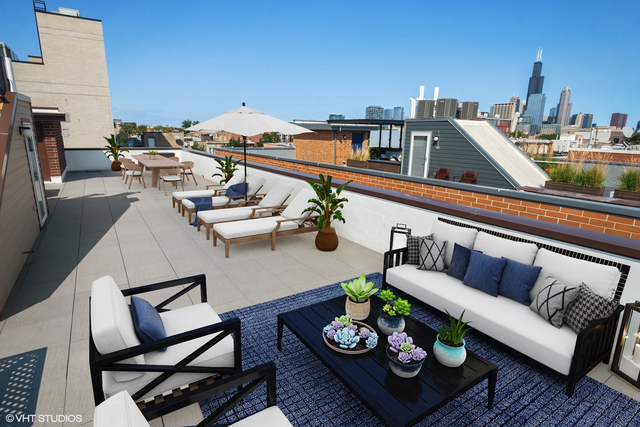1424 West Fillmore Street, Unit 3E Chicago, IL 60607 - Photo 19 of 21 a view of a roof deck with furniture and a rug