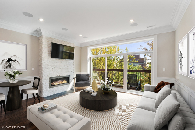 1424 West Fillmore Street, Unit 3E Chicago, IL 60607 - Photo 6 of 21 a living room with furniture and a fireplace