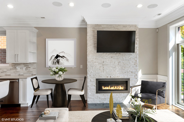 1424 West Fillmore Street, Unit 3E Chicago, IL 60607 - Photo 8 of 21 a living room with furniture a flat screen tv and a fireplace