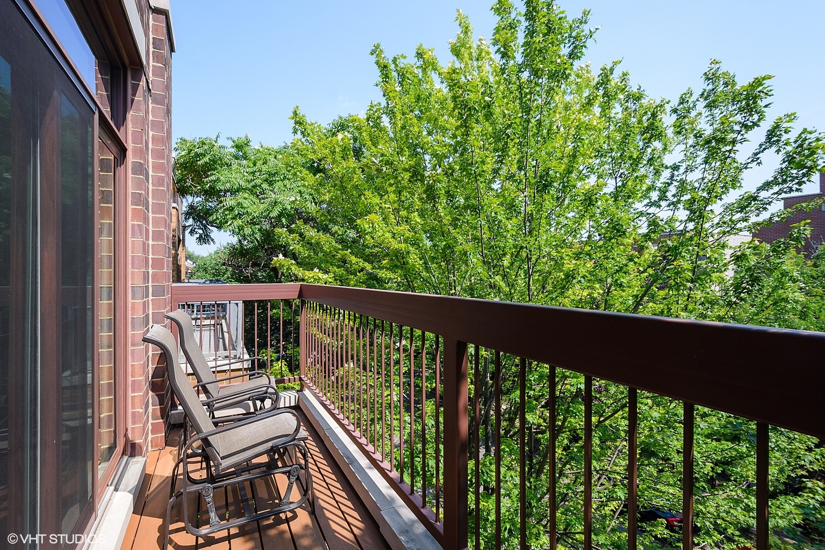 1424 West Fillmore Street, Unit 3E Chicago, IL 60607 - Photo 9 of 21 a view of a balcony with wooden floor