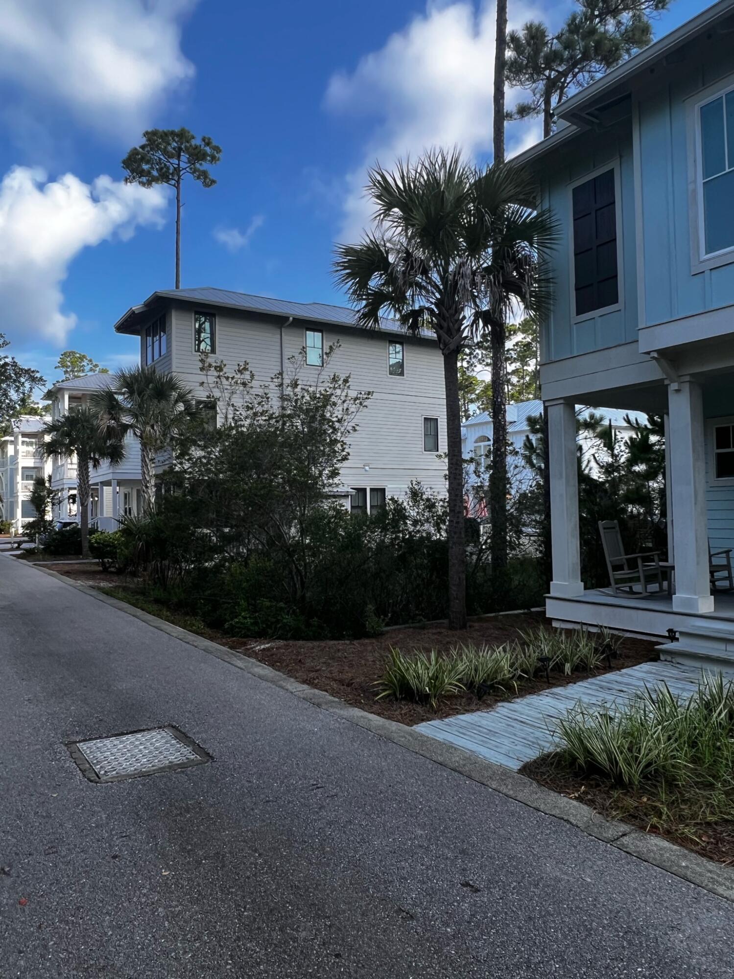 Lot 77 Redbud Ln Inlet Beach Inlet Beach, FL 32461 - Photo 3 of 10 a front view of a house with a yard