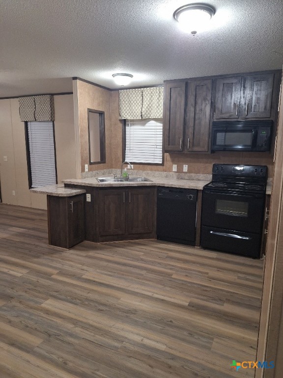 46 County Road 400 Yoakum, TX 77995 - Photo 15 of 23 a kitchen with wooden cabinets and a sink