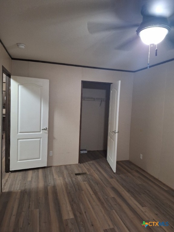 46 County Road 400 Yoakum, TX 77995 - Photo 16 of 23 a view of a room with wooden floor and a ceiling fan