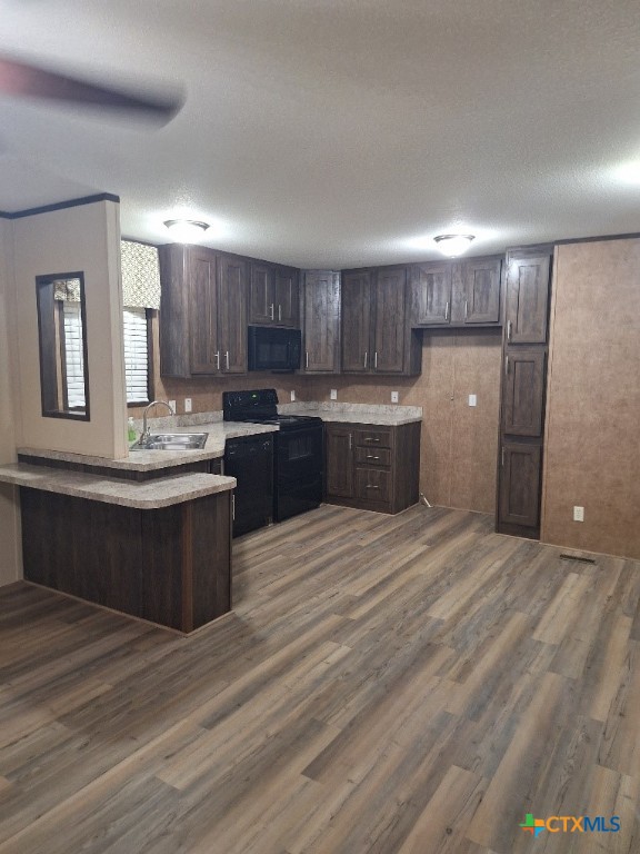 46 County Road 400 Yoakum, TX 77995 - Photo 20 of 23 a kitchen with kitchen island granite countertop a sink cabinets and stainless steel appliances