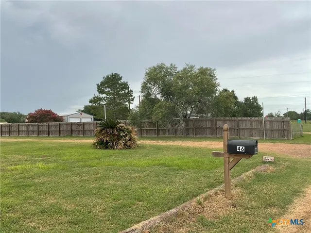 a view of a golf course with a lake