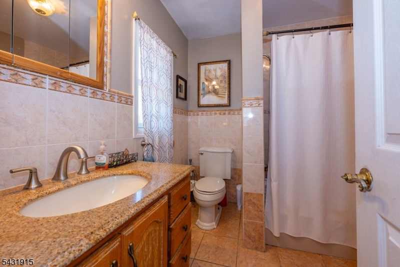 41 Waterloo Road Stanhope, NJ 07874 - Photo 11 of 32 a bathroom with a sink toilet and shower