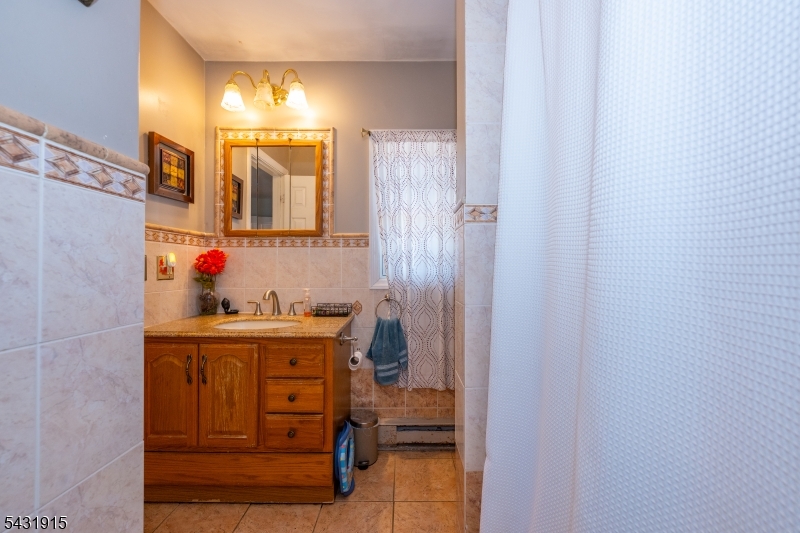 41 Waterloo Road Stanhope, NJ 07874 - Photo 12 of 32 a bathroom with a sink and a shower