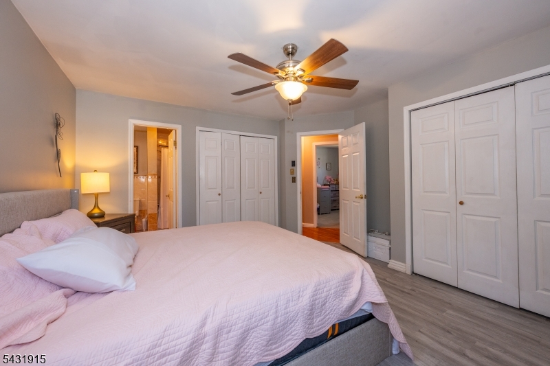 41 Waterloo Road Stanhope, NJ 07874 - Photo 15 of 32 a bedroom with a bed and a chandelier