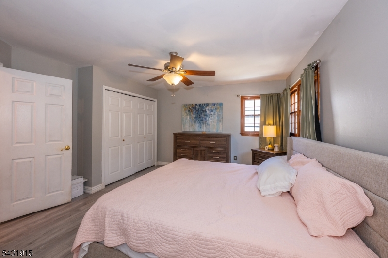 41 Waterloo Road Stanhope, NJ 07874 - Photo 16 of 32 a bedroom with a bed and a chandelier