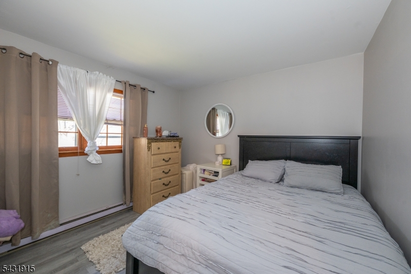 41 Waterloo Road Stanhope, NJ 07874 - Photo 17 of 32 a bedroom with a bed and a window