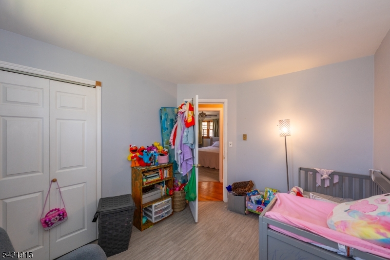 41 Waterloo Road Stanhope, NJ 07874 - Photo 19 of 32 a bedroom with bed and wooden floor