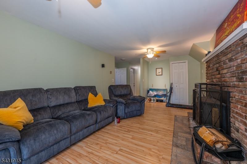 41 Waterloo Road Stanhope, NJ 07874 - Photo 21 of 32 a living room with furniture and a fireplace