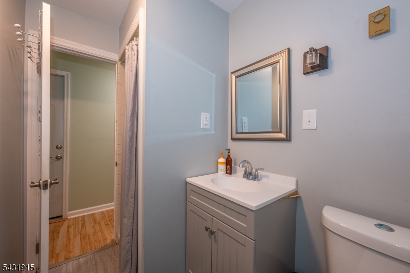 41 Waterloo Road Stanhope, NJ 07874 - Photo 23 of 32 a bathroom with a sink toilet and mirror