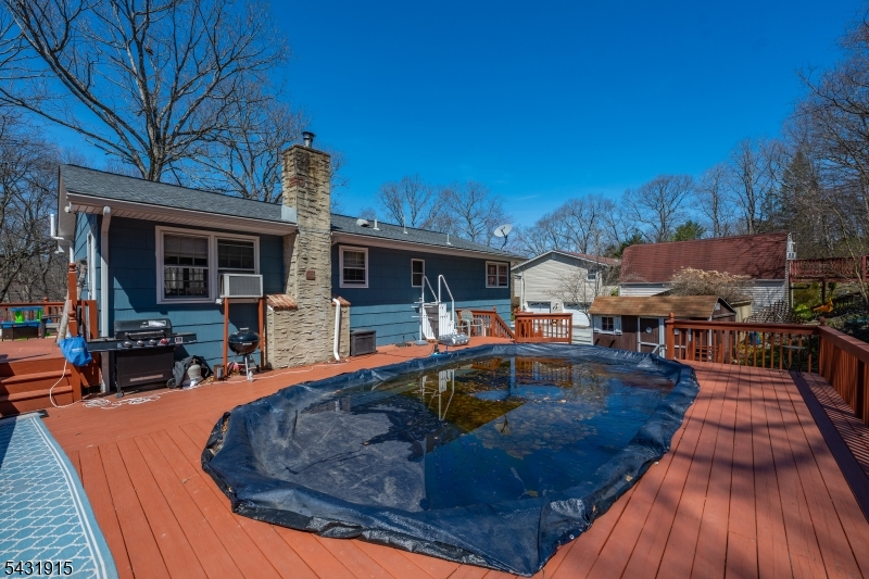 41 Waterloo Road Stanhope, NJ 07874 - Photo 30 of 32 a view of a house with swimming pool and sitting area