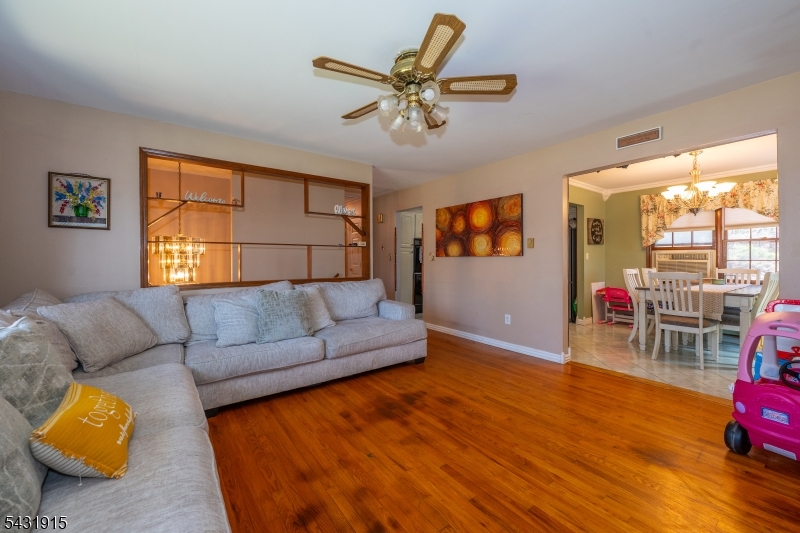 41 Waterloo Road Stanhope, NJ 07874 - Photo 3 of 32 a living room with furniture and a wooden floor