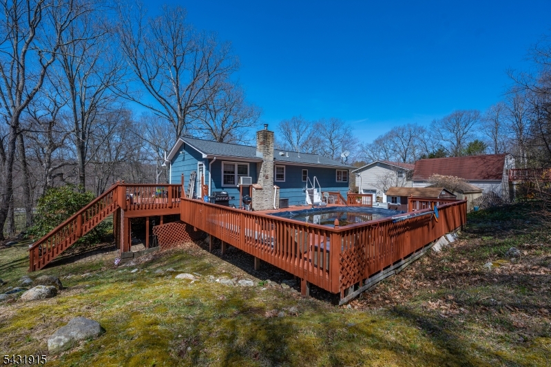 41 Waterloo Road Stanhope, NJ 07874 - Photo 32 of 32 a view of a house with roof deck