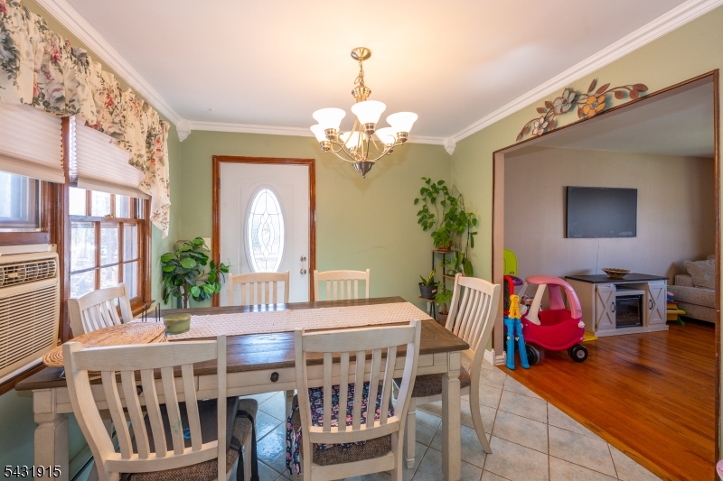 41 Waterloo Road Stanhope, NJ 07874 - Photo 9 of 32 a view of a dining room with furniture wooden floor and chandelier