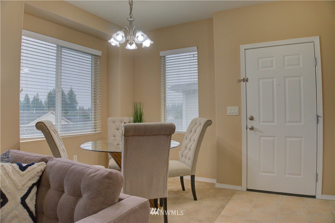 14915 38th Drive Southeast, Unit EE2029 Bothell, WA 98012 - Photo 1 of 12 a view of a dining room with furniture and window