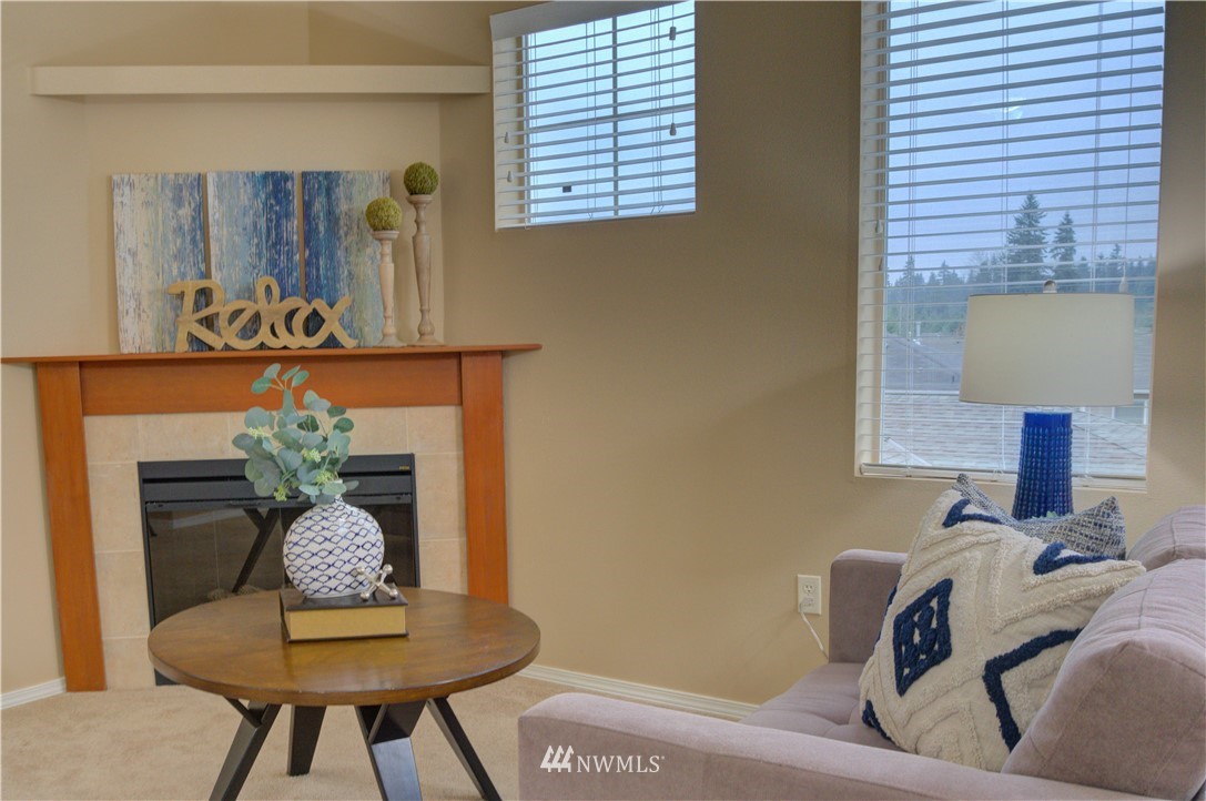 14915 38th Drive Southeast, Unit EE2029 Bothell, WA 98012 - Photo 7 of 12 a living room with furniture and a potted plant