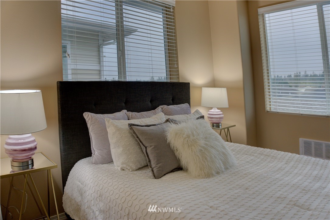 14915 38th Drive Southeast, Unit EE2029 Bothell, WA 98012 - Photo 10 of 12 a bedroom with a bed and a night stand