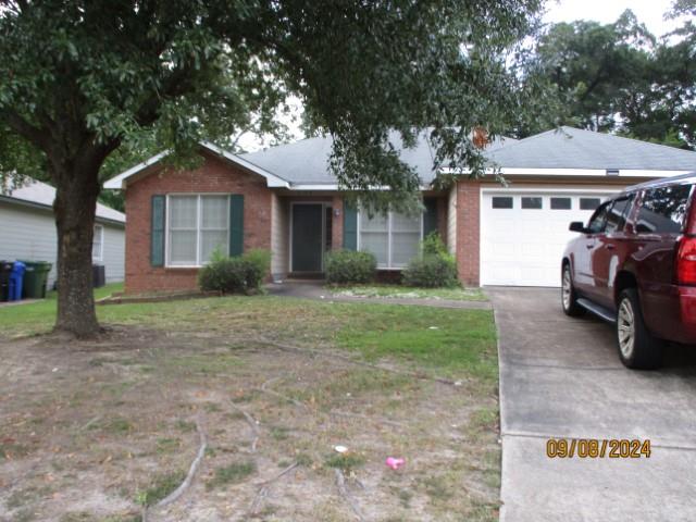 5249 Kingsberry Street Columbus, GA 31907 - Photo 1 of 5 a front view of a house with garden