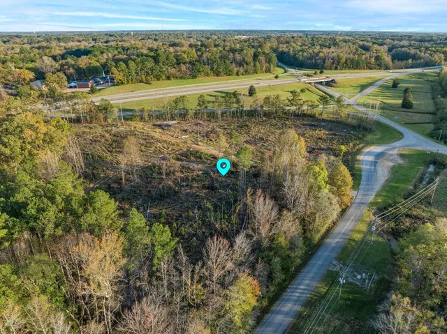 a view of a town with mountains in the background