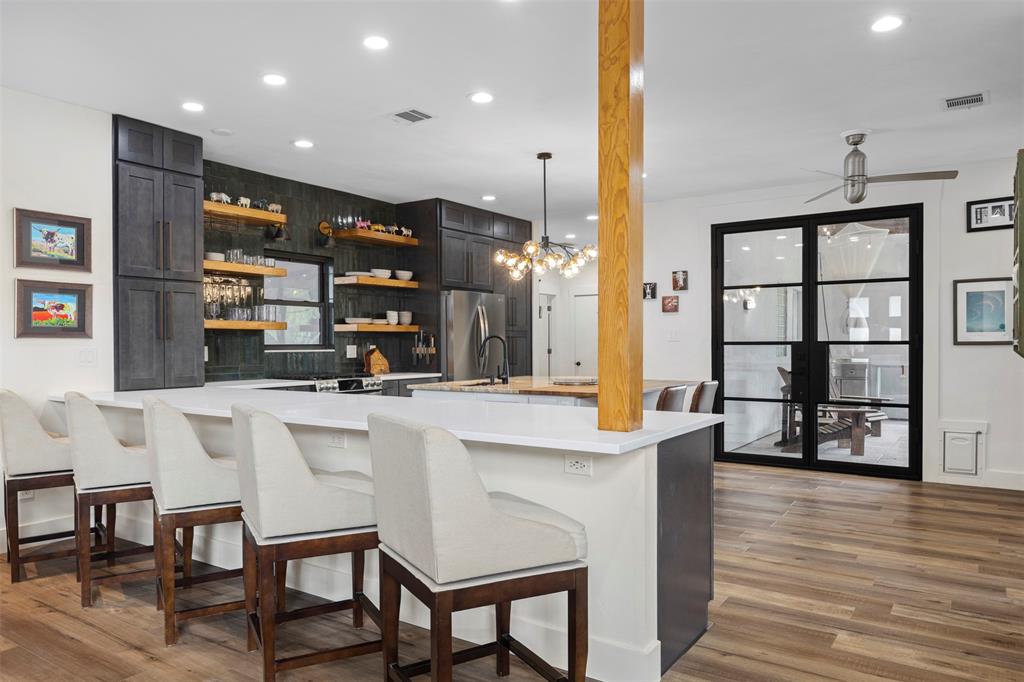 3371 Regent Drive Dallas, TX 75229 - Photo 9 of 36 Plenty of room for barstools at the peninsula and island.