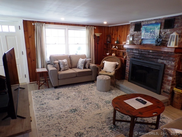 64 Washington Avenue Old Lyme, CT 06371 - Photo 12 of 25 a living room with furniture a rug and a fireplace