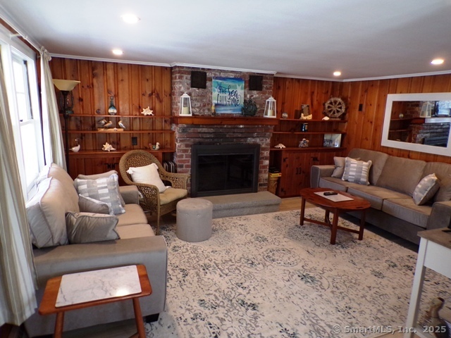 64 Washington Avenue Old Lyme, CT 06371 - Photo 13 of 25 a living room with furniture and a fireplace