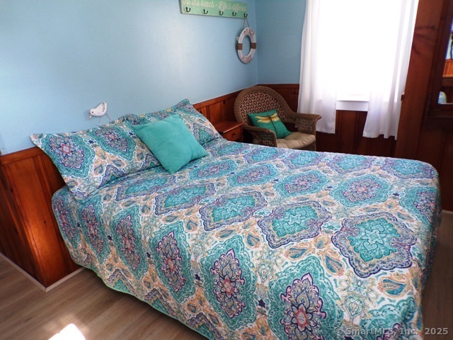 64 Washington Avenue Old Lyme, CT 06371 - Photo 16 of 25 a bedroom with a bed and window