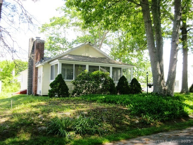 64 Washington Avenue Old Lyme, CT 06371 - Photo 2 of 25 a front view of a house with a yard