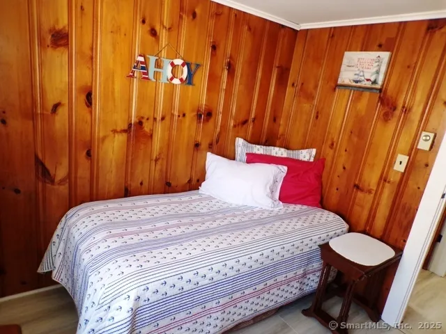 a bedroom with a bed and a bathroom