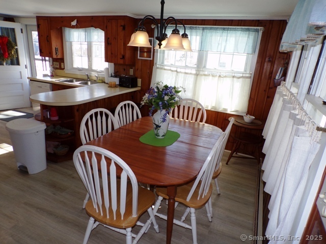 64 Washington Avenue Old Lyme, CT 06371 - Photo 10 of 25 a view of a dining room with furniture window and wooden floor