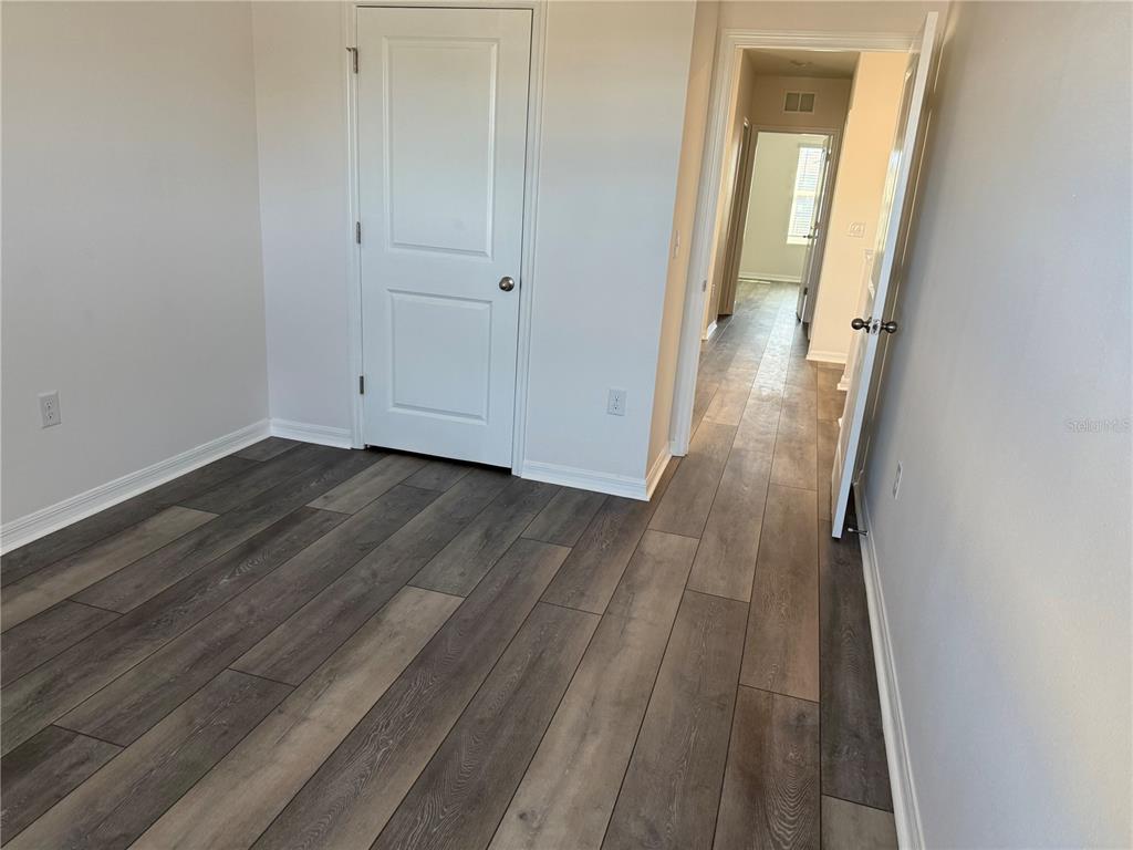 5864 Calla Lilly Drive Sarasota, FL 34232 - Photo 14 of 16 wooden floor in a gallery