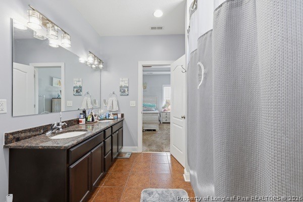 7289 Fire Dept Road Hope Mills, NC 28348 - Photo 23 of 49 a bathroom with a double vanity sink a mirror and a shower