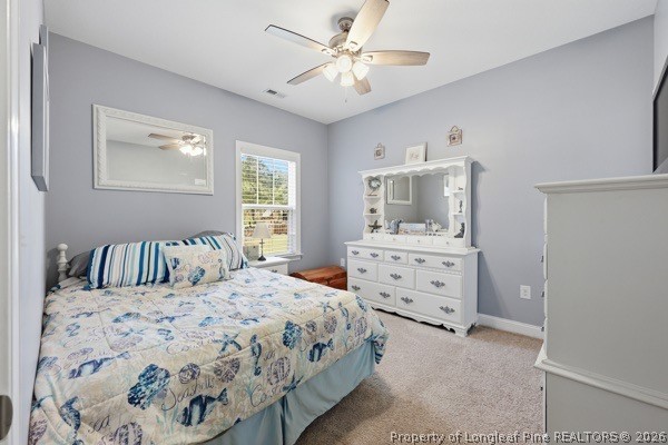 7289 Fire Dept Road Hope Mills, NC 28348 - Photo 25 of 49 a bedroom with a bed and a dresser