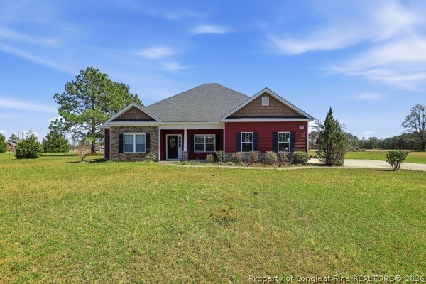 7289 Fire Dept Road Hope Mills, NC 28348 - Photo 3 of 49 a front view of a house with a garden