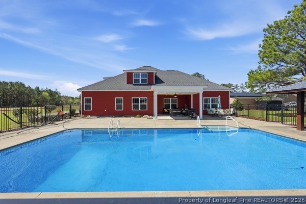 7289 Fire Dept Road Hope Mills, NC 28348 - Photo 37 of 49 a view of house with outdoor space and swimming pool