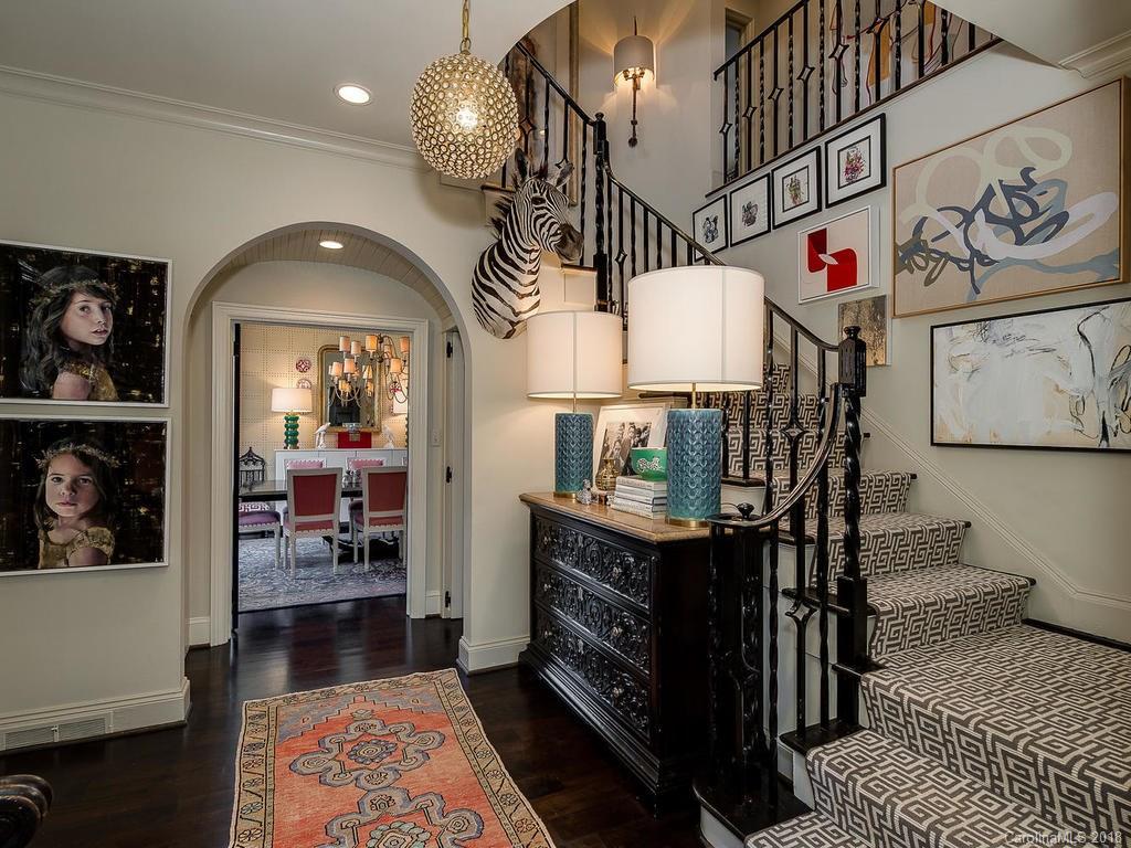 661 Colville Road Charlotte, NC 28207 - Photo 2 of 36 a view of entryway dining room and hall with wooden floor