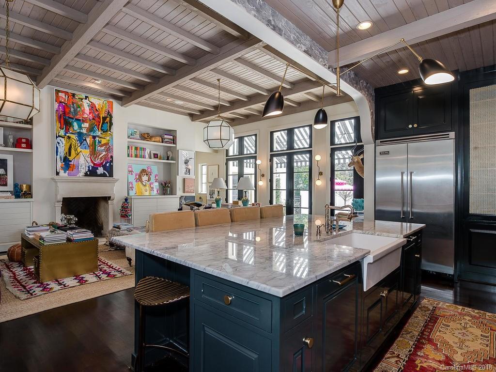 661 Colville Road Charlotte, NC 28207 - Photo 11 of 36 a dining table with kitchen island furniture and a kitchen view